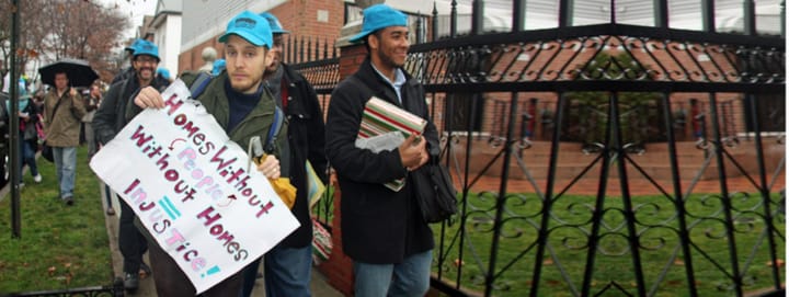 Baby Sam at a protest demanding housing for homeless folks, circa 2008
