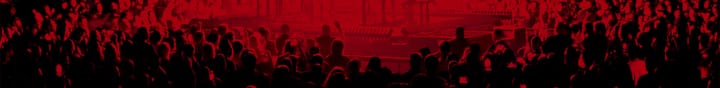 Red-tinted image of a crowd at a show. 